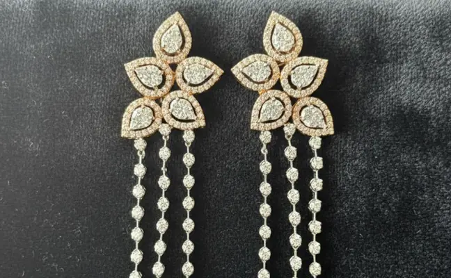 Multi-layered long necklace and matching floral chandelier earrings.