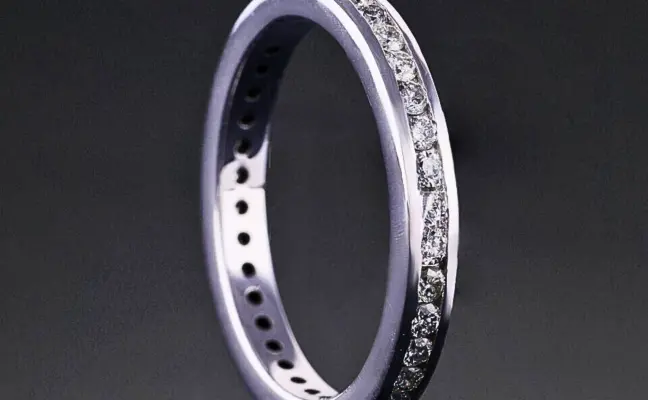 Channel Set Round Diamond Wedding Band.