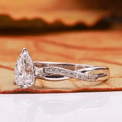 Pear Cut Lab Grown Diamond Engagement Ring With Twisted Pave Band