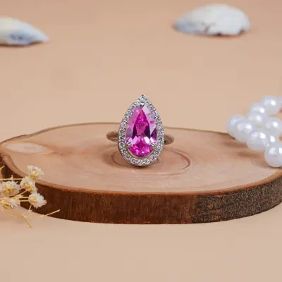 Pear Cut Halo Pink Sapphire & Engagement Diamond Ring