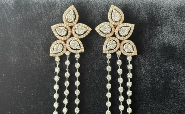 Multi-layered long necklace and matching floral chandelier earrings.