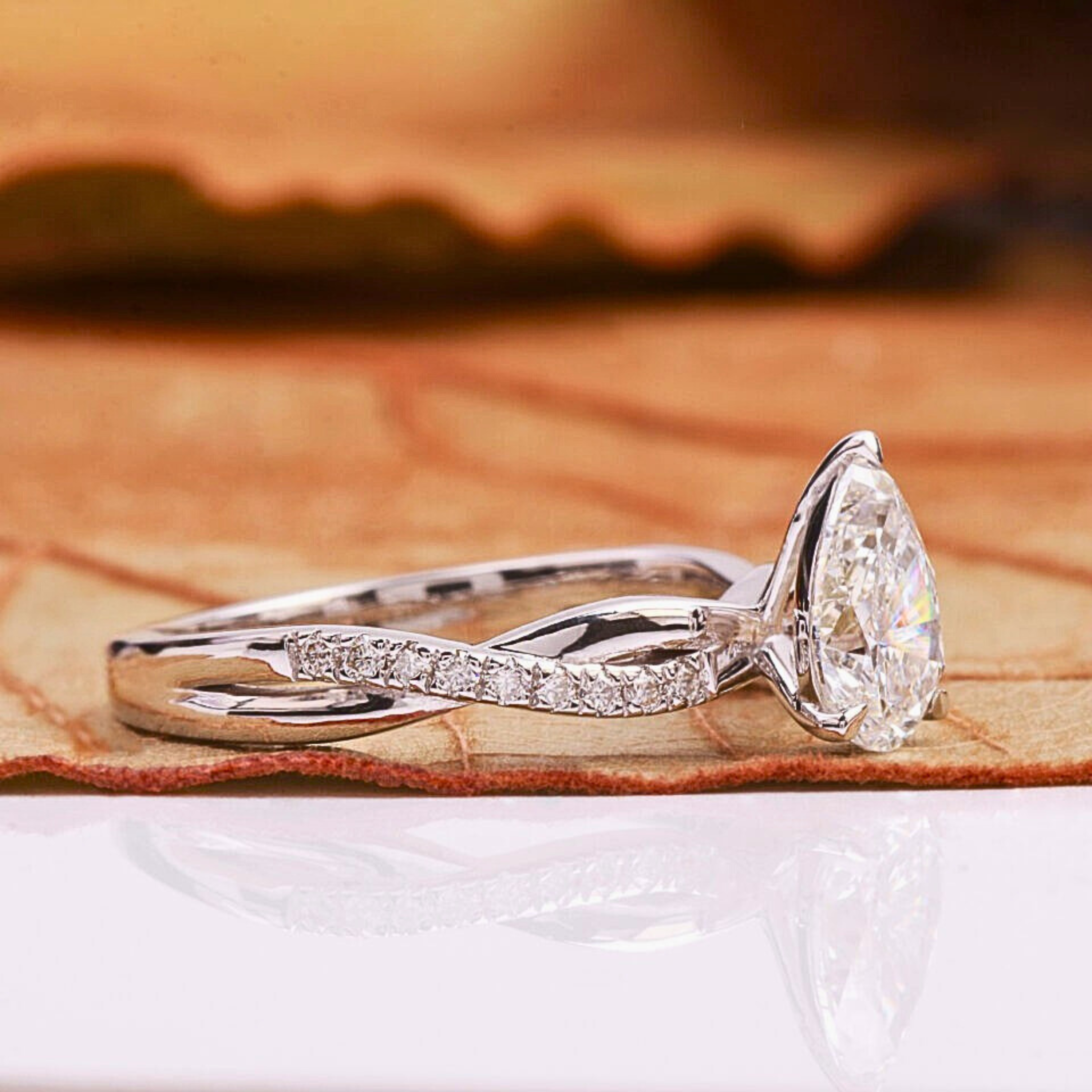Pear Cut Lab Grown Diamond Engagement Ring With Twisted Pave Band